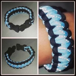 My own glow in the dark paracord bracelet, and it comes with snap on lock with whistle.